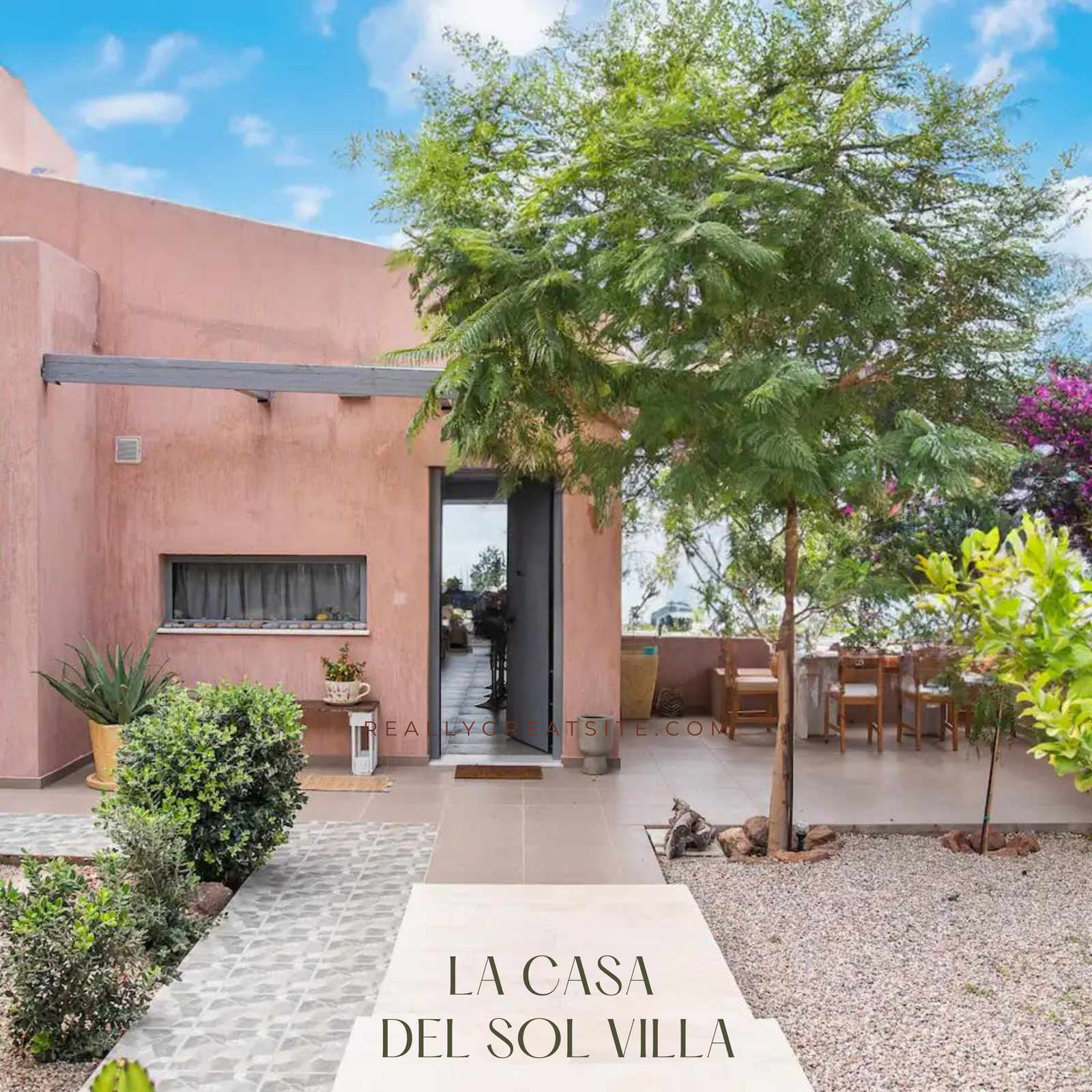 a house with a patio and trees